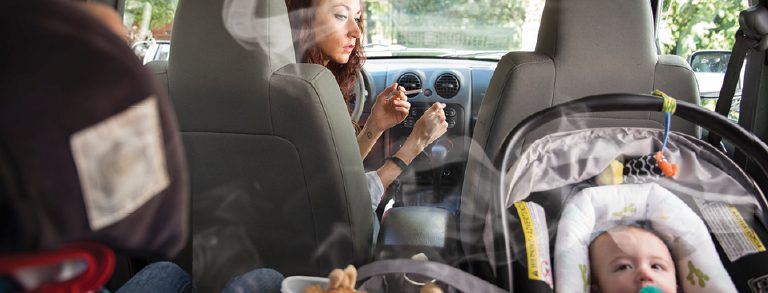 smoking in a car passing secondhand smoke to passengers.