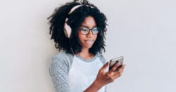 Teenage girl with headphones and phone