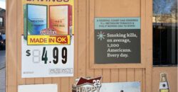 Smoking kills sign on a building selling tobacco