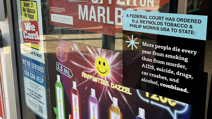Signage in the window of a convenience store