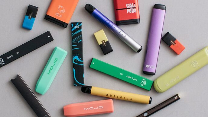 Flat lay of various colorful vaping products